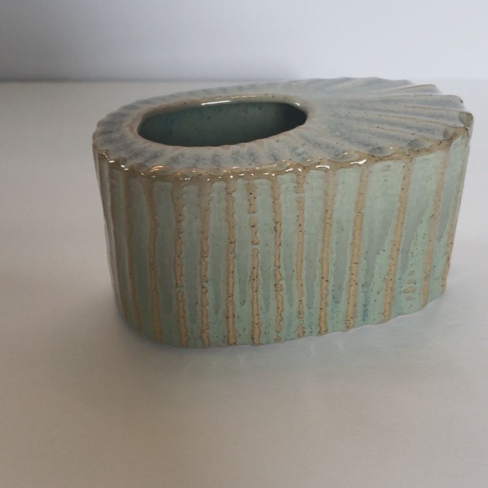 4.5" greenish Blue Ribbed Ceramic Oval Vase with offset opening.